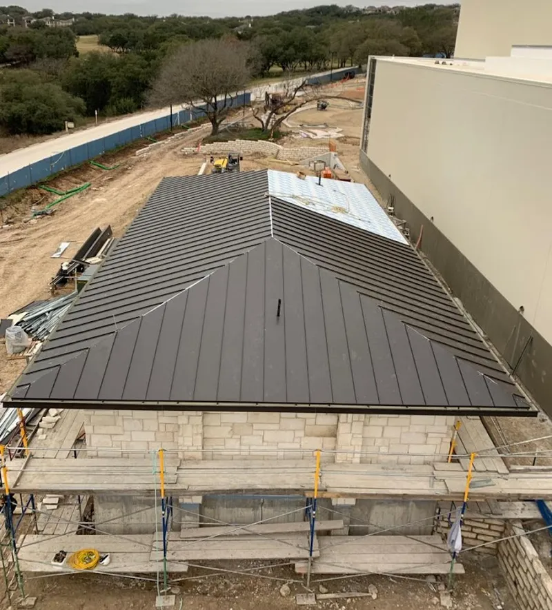 Metal roof new construction with scaffolding in Crete